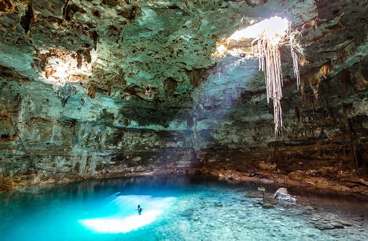 Swimming in a cenote in the Yucutan, Mexico.