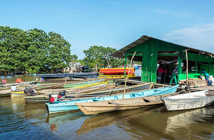 Small boats for hire at a dock in Leticia, Colombia