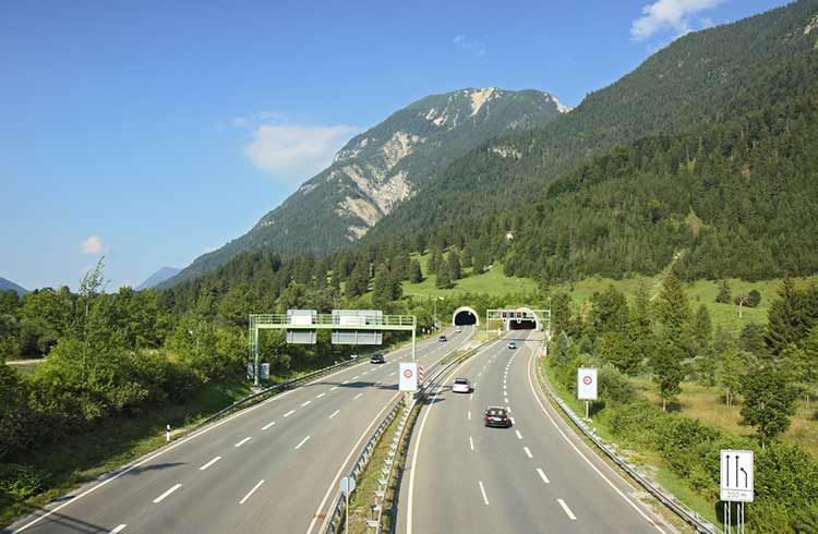 A tunnel goes through a mountain in the German Alps