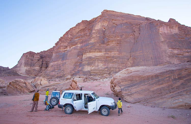 Travelers exploring Wadi Rum in Jordan.