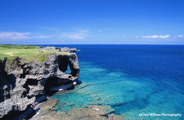 Cliffs and turquoise waters on the Motobu Peninsula, Okinawa, Japan.