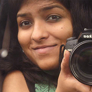 A photo of Divya with camera