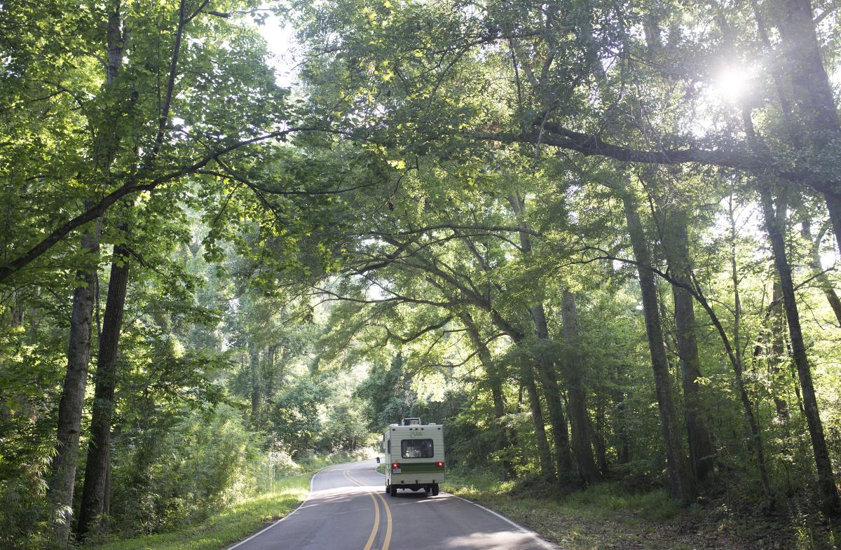 The RV drives through the Natchez Parkway.