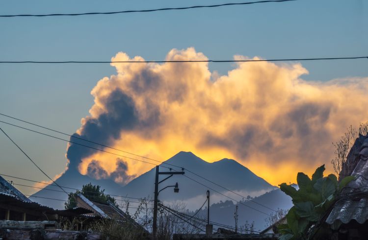 A volano erupting in the distance, Guatemala
