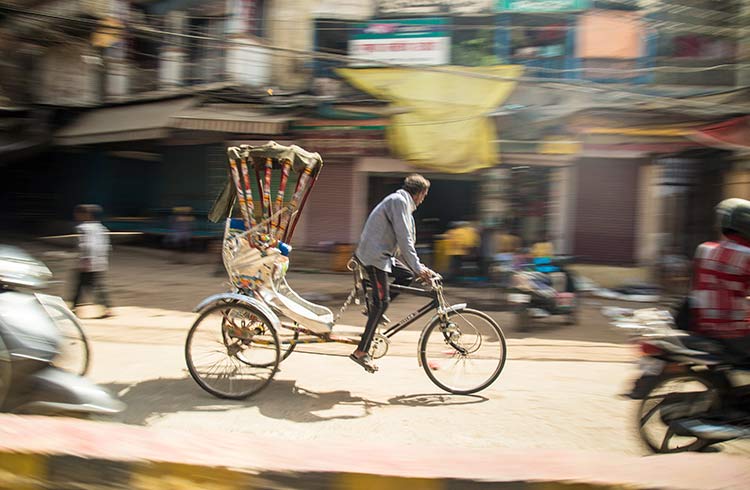 A man rides a bike in India
