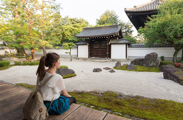 Japanese young woman looking at Kyoto Hyakumanben Chionji Temple Garden