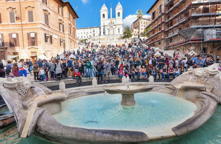 Crowd of tourists on Spanish Steps on Piazza di Spagna in Rome