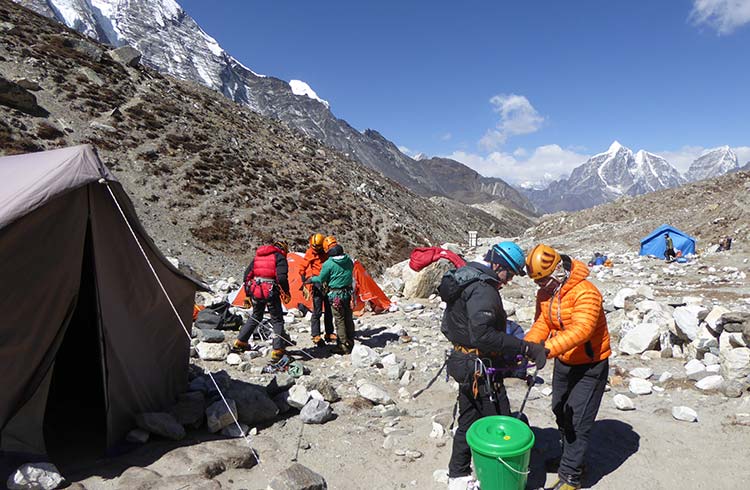 People preparing for their trek at base camp