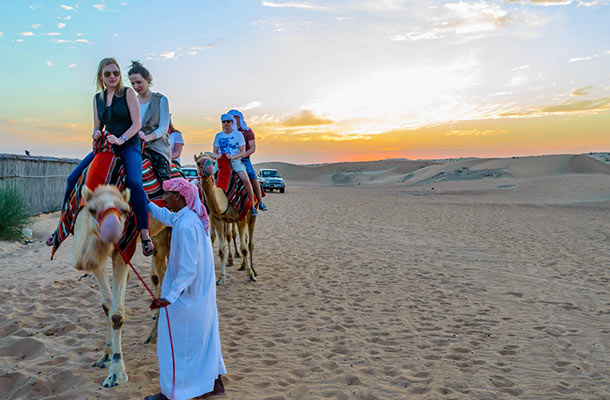 Camel ride at sunset