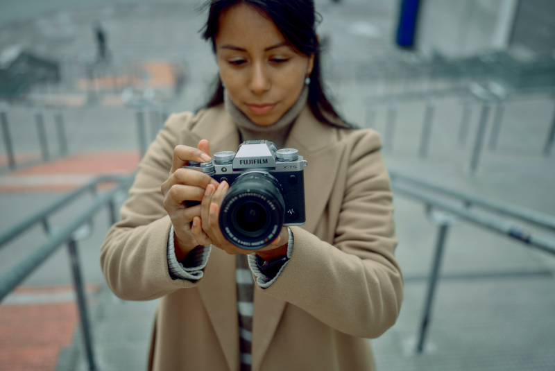 A woman using a camera