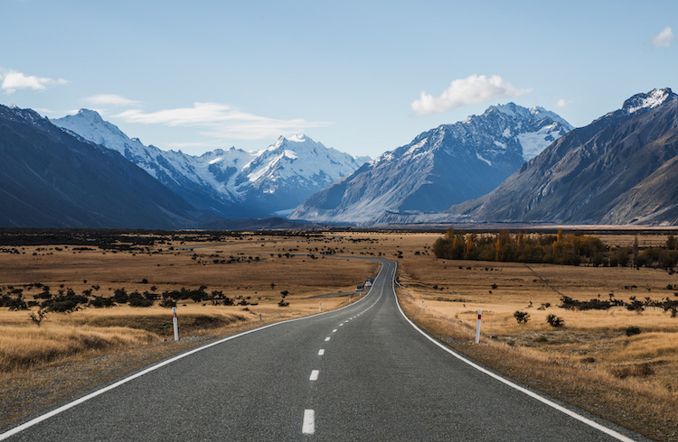 road runs to mountains on horizon