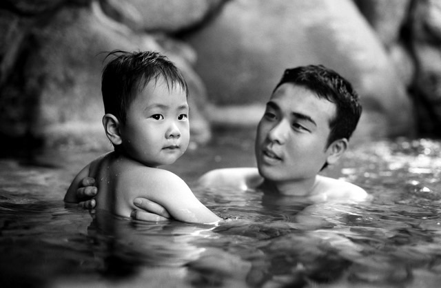 Man and child bathing