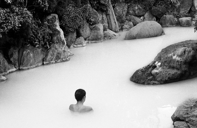 A man bathing in a hot spring