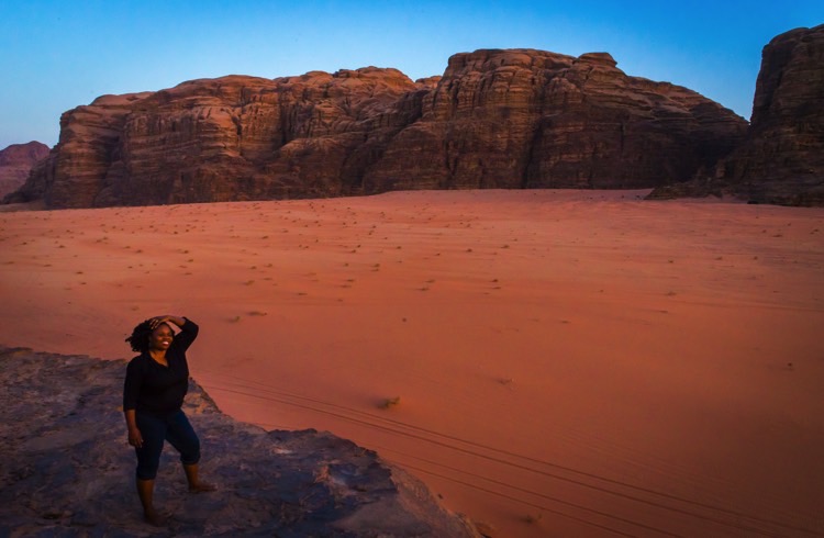 A woman in a desert scene