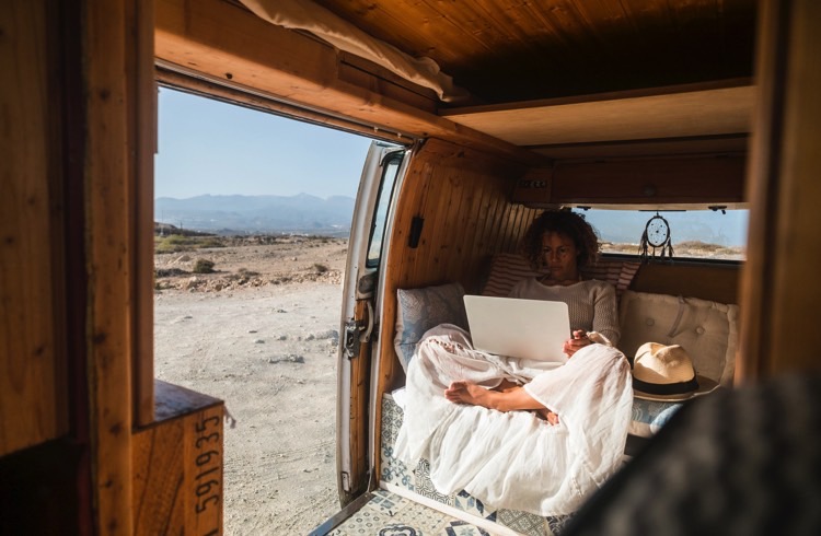A writer in a campervan