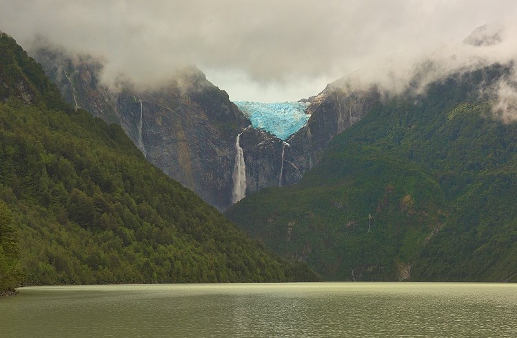The Ventisquero Colgante hanging glacier, with waterfalls flowing from its base, in Queulat National Park, Chile.