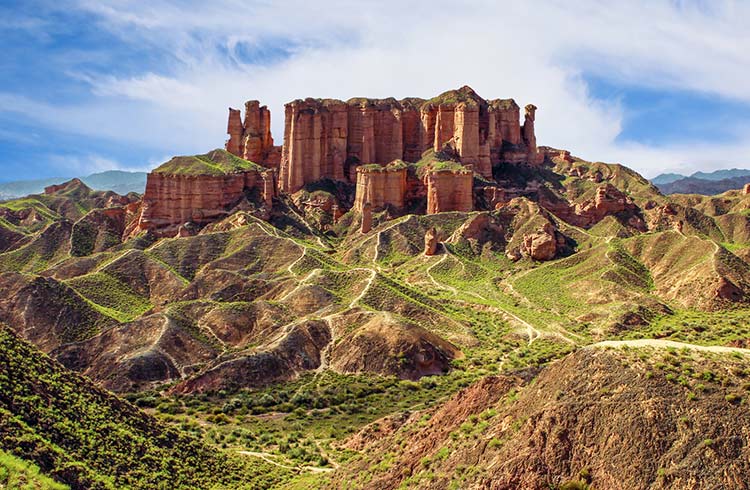 Towering landforms over a vast landscape in Gansu