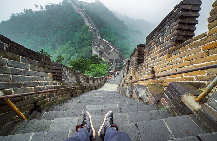 Sitting on the Great Wall of China on a misty day