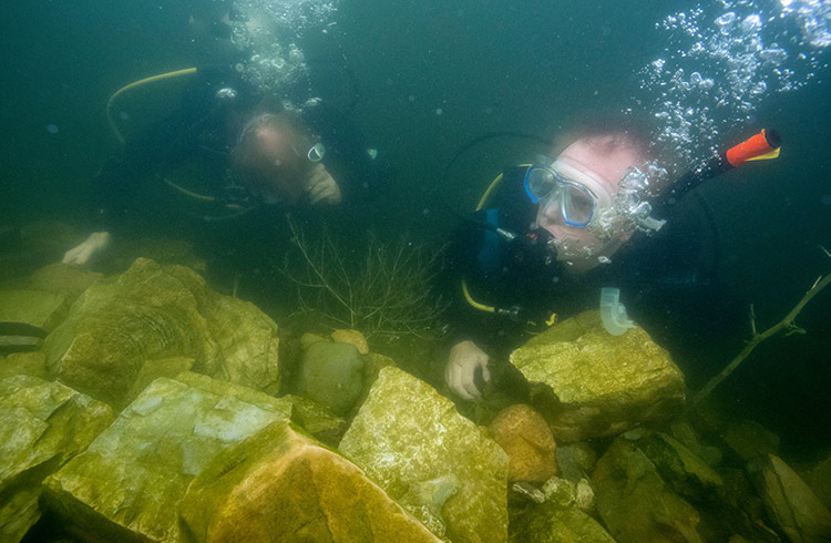 Jamie Fullerton and dive master Steven Schwankert dive near the Great Wall