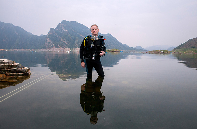 Jamie Fullerton stands in the water at Panjiakou Reservoir in Hebei Province, China