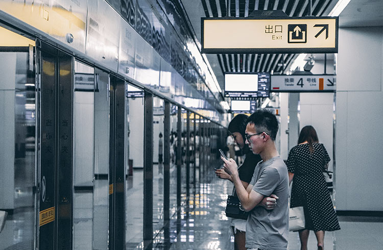 People using their phones in ChongQing, China