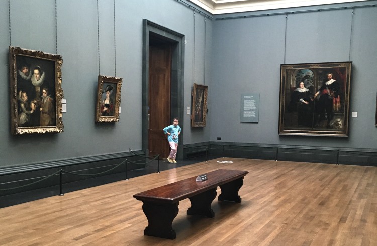 A room hung with paintings but with almost no visitors at the National Gallery in London.