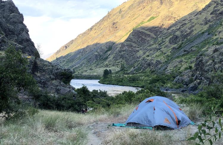 A tent set up on a bluff overlooking the Snake River gorge in Idaho.