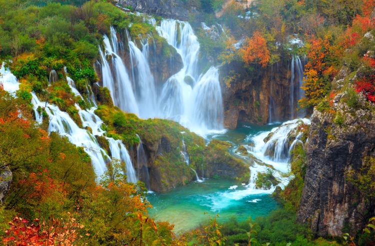Waterfalls, turquoise lakes, and autumn foliage at Plitvice Lakes National Park in Croatia.