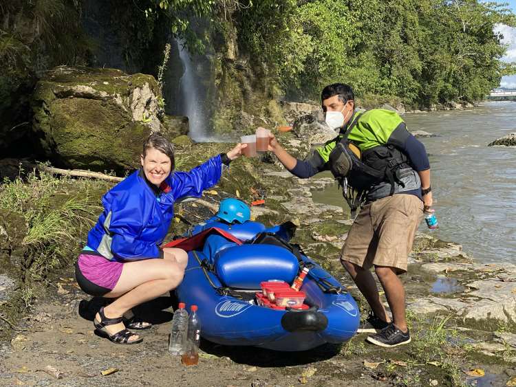 A woman takes a break with her guide during a kayaking trip through the Ecuadorian Amazon.
