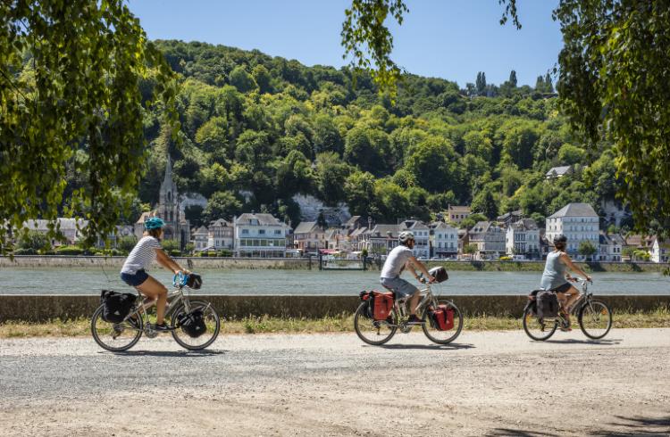 A group of cyclists pedal along the Seine near the village of La Bouille in northern France. 