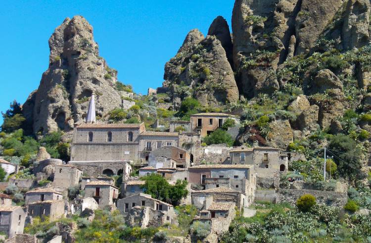 The deserted village of Pentedattilo clings to a hilltop in Calabria, Italy.