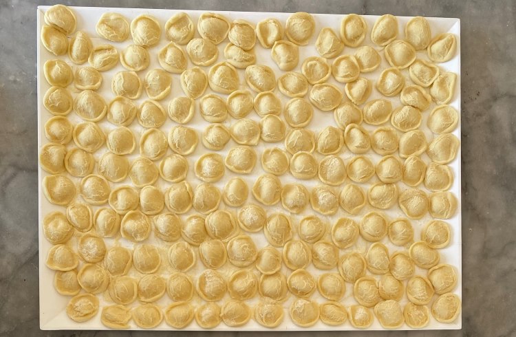 A platter of hand-made orecchiette pasta, a specialty of Italy's Puglia region.