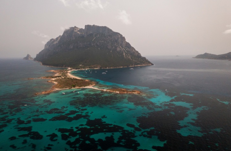 Turquoise waters around the "island kingdom" of Tavolara, off the coast of Sardinia, Italy.
