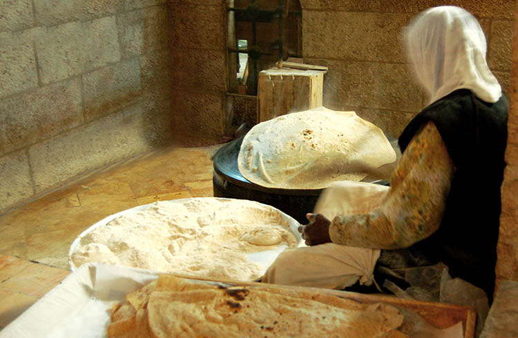 Jordanian woman making traditional bread.