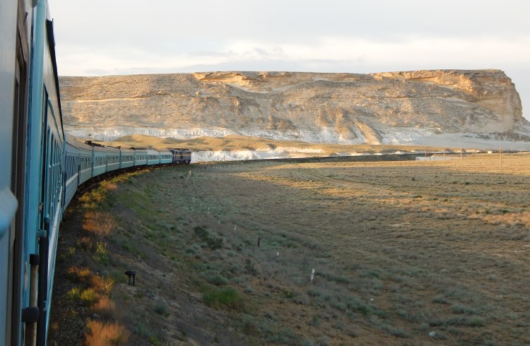 A train crosses the Kazakh Steppe in northern Kazakhstan.