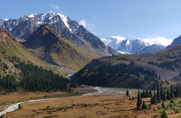 Rocky, snow-covered peaks of the Trans-Ili Alatau mountain range in Kazakhstan.
