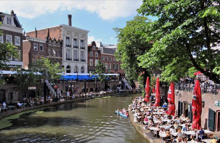 Canal-side wharf cellars are turned into outdoor cafes in the town of Utrecht, the Netherlands.