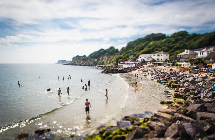 Bathers at Steephill Cove Beach on the Isle of Wight, United Kingdom.