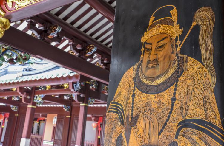 A Taoist “door god” painted on the wooden entrance to Thian Hock Keng Temple in Singapore.