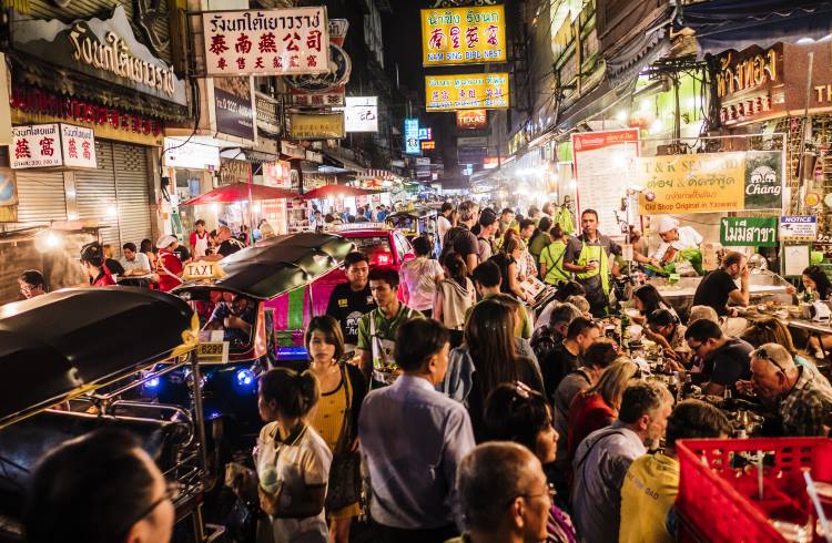 Crowds of shoppers and diners at the night market in Bangok's Chinatown.