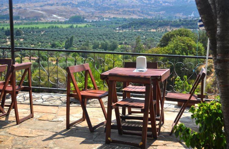 A table at a terrace restaurant overlooking vineyards on the Turkish island of Gokceada.