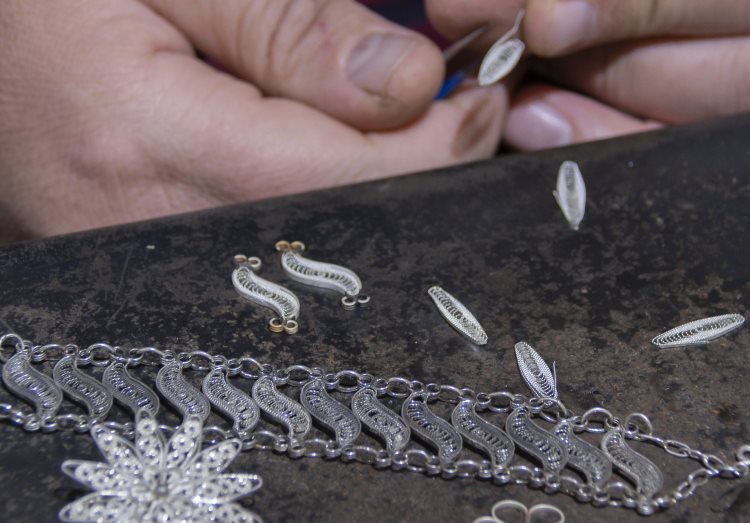 An artisan creates silver filigree jewelry near Mardin, Turkey.
