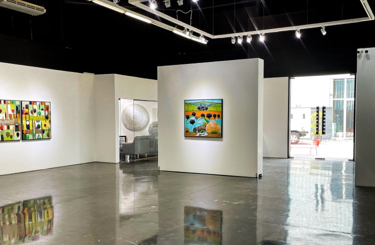 Colorful paintings in Zawyeh Gallery, Al Quoz district, Dubai.