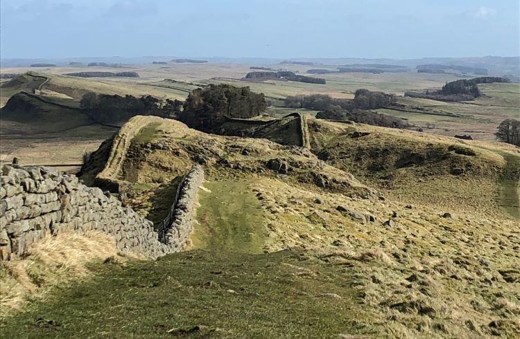 Hadrian's Wall undulates across the top of hills in England.