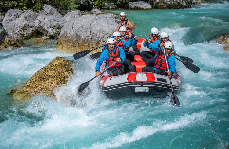 White-water rafting on the ice-blue Soca River in Slovenia.