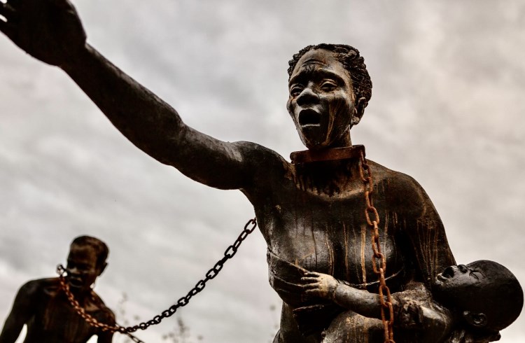A sculpture of enslaved Africans in chains, at the National Memorial for Peace and Justice in Montgomery, Alabama.