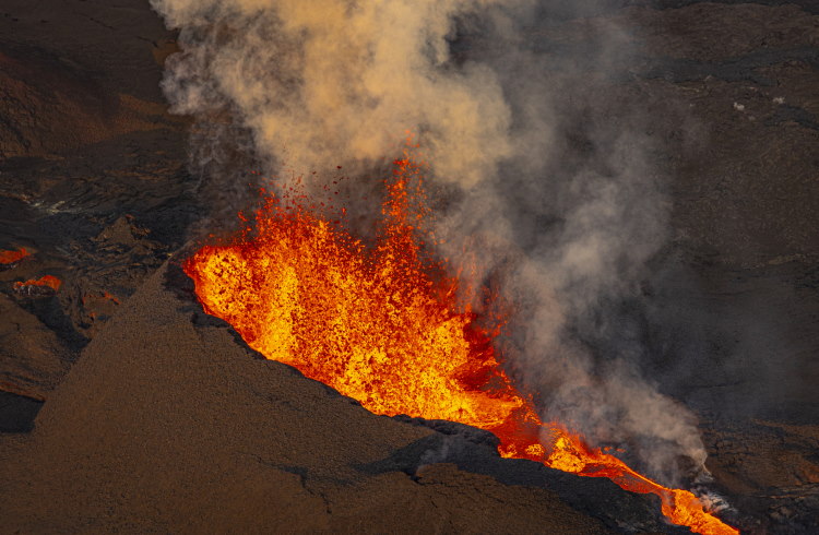 Mauna Loa volcano spews lava into the sky.