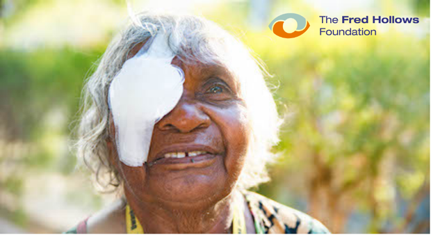 A woman wearing an eye bandage and the Fred Hollows Foundation logo