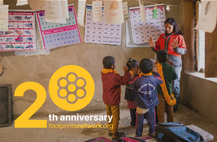 A woman teaching children in a classroom