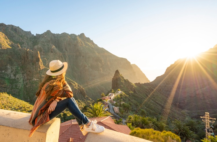 Tourist admiring Masca village at sunset. Masca, Tenerife, Canary Islands